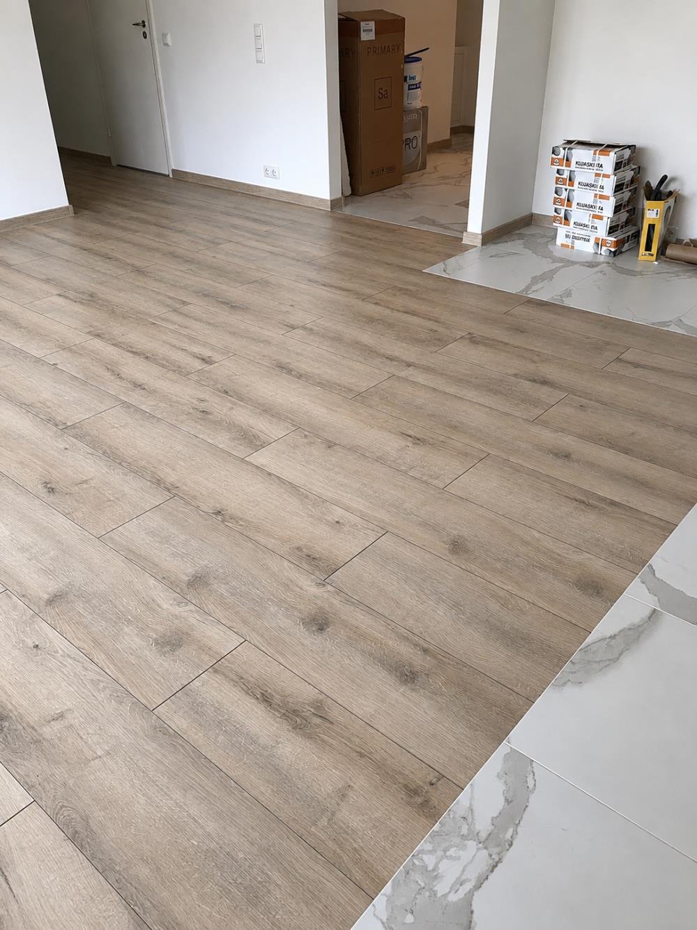 Light grey oak laminate flooring installation